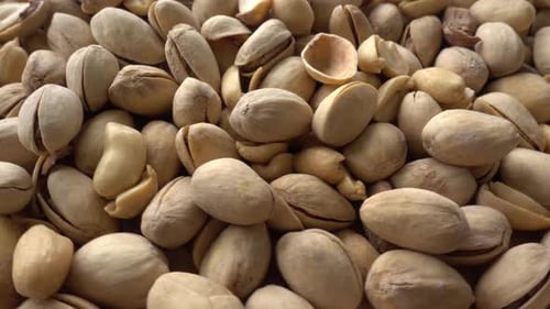Food background. Roasted pistachio nuts seed with shell close up. Dieting concept