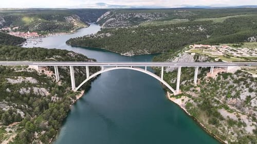 Drone flight above a beautiful arch bridge near the town of Shibenik in Croatia