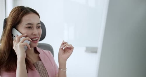 Smiling Young Woman On Phone Call At Office