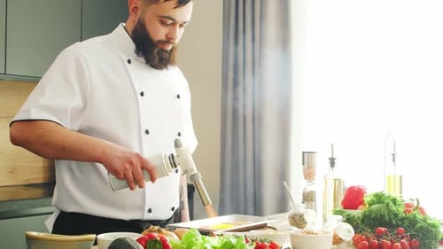 Chef Uses Blow Torch in Bright Kitchen