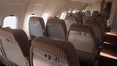 Rows of Empty Seats in an Airplane Cabin