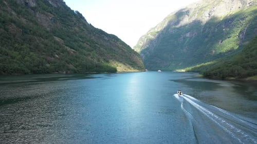 speedboat cruising through the fjord in Norway