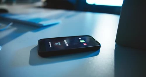 Mobile, phone and screen with incoming call on desk with private number