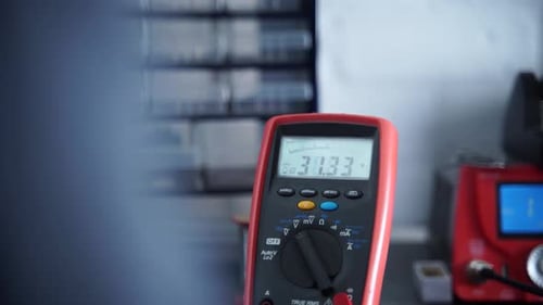 Close-up of Multimeter Displaying Fluctuating Readings