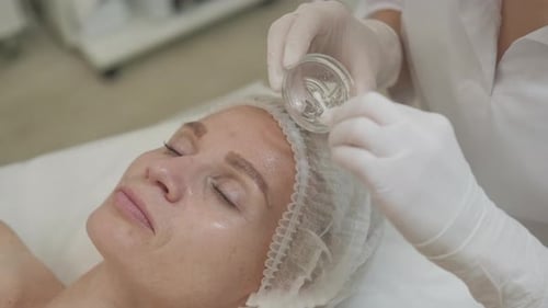 Adult Woman Receiving Facial Treatment at Medical Spa
