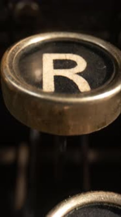 Typewriter Keys Being Pressed in Extreme Close-up