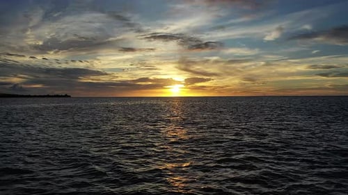 Dramatic Ocean Sunset with Vibrant Clouds