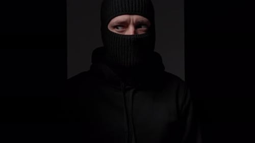 Man in Balaclava and Hoodie Looks Intimidating