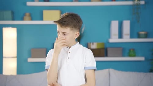 Thoughtful Boy Thinking About Something in his Home