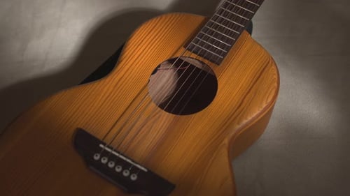Warm Gentle Strumming Casual Musical Setting Showcasing Strings And Wood Grain In Warm Ambient Light
