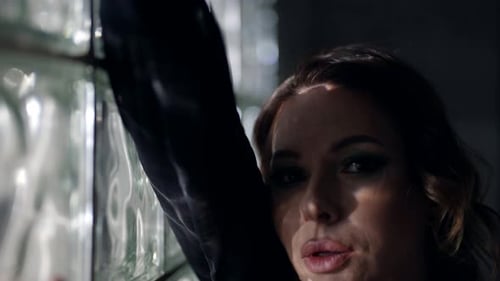 Attractive Woman with Professional Makeup Closeup Sensual Portrait in Studio Looking at Camera