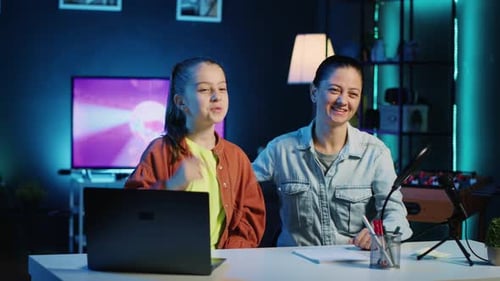 Girl and Woman Recording a Podcast in Blue Room