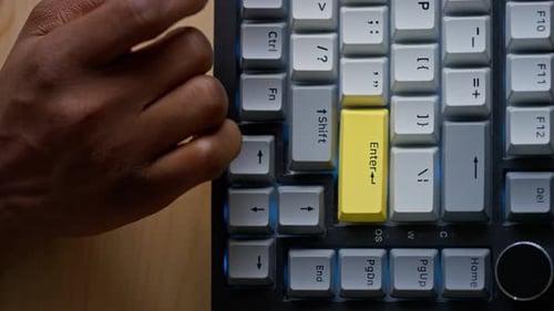 Top View of Female Hand Typing Password on Keyboard and Pressing Enter
