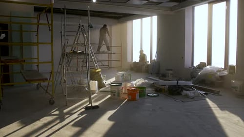 Construction Workers Building Walls in Modern Office