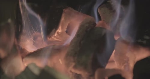 Charcoal Burning In a Grill With Flames And Blaze. Close Up Shot