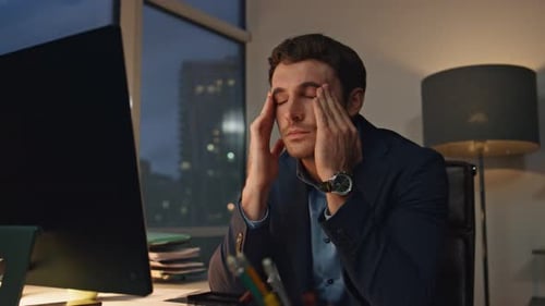 Stressed Employee Massaging Head Closeup