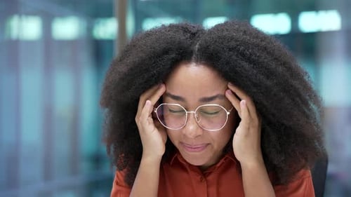 Stressed Woman Massaging Temples Due To Headache