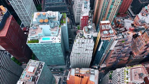 Lounge zones on the roofs of the high-rise building in the city downtown.