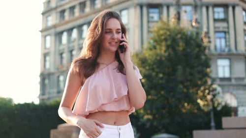 Portrait View of the Attractive Young Woman Talking Smartphone Outdoors Beautiful Caucasian Girl