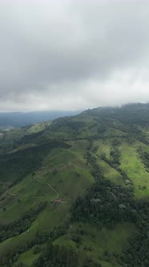 Aerial video over Salento towards a lush forested valley in the mountains of Colombia, Colombia