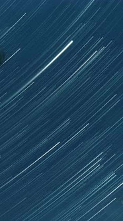 Striking Star Trails Against a Dark Blue Sky
