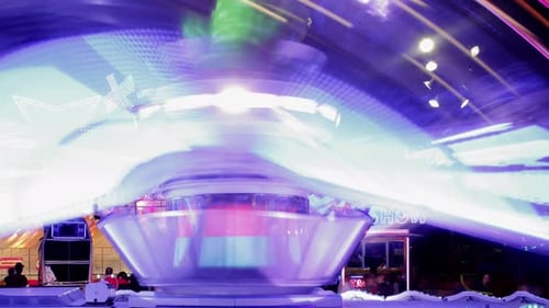 Spinning Amusement Ride Lights at Night
