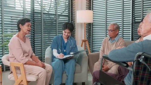 Caregiver Talking With Seniors in a Comfortable Setting