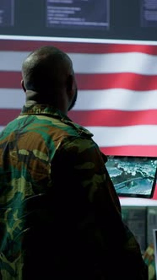 Vertical Video Military Personnel in High Tech Office Handle Surveillance Activity on World Map