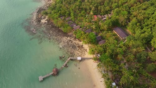 Aerial view of Ao Taphao Beach glowing in golden hour light, Koh Kood, Thailand
