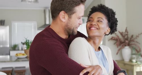 Loving Couple Embracing in Modern Home Interior