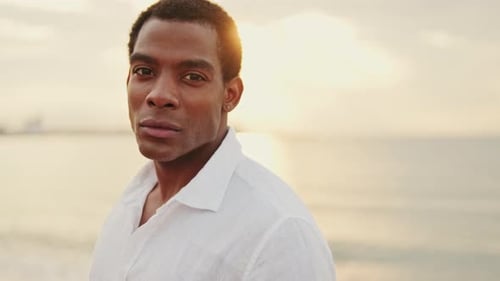 Handsome Man on Beach at Sunset