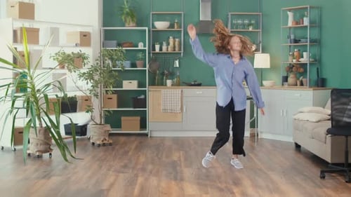 Carefree Woman Dancing at Home
