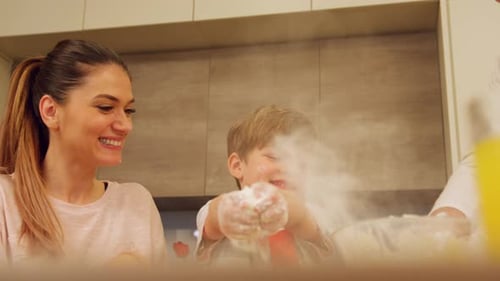 Parents and child enjoying baking together