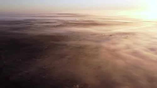 Aerial View Sunrise Flight Over the Morning Fog in the Countryside