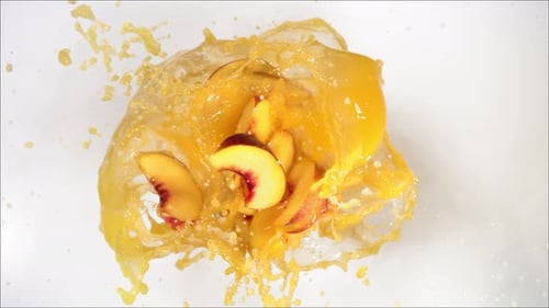 Super Slow Motion of Explosion Peach and Burst Juice and Slices