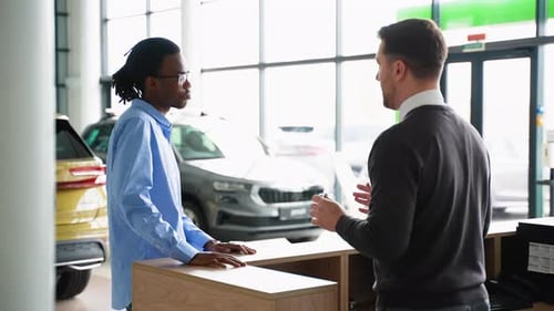 Customer Receiving Car Keys at Dealership
