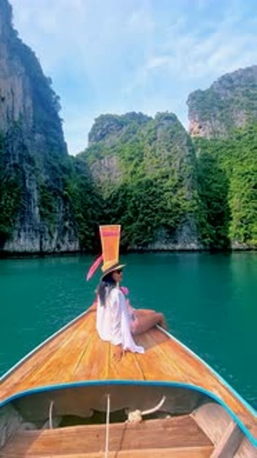Pileh Lagoon with Green Emerald Ocean at Koh Phi Phi Thailand Women in Front of Longtail Boat