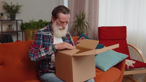 Angry Dissatisfied Shopper Senior Old Man Unpacking Parcel Feeling Upset Confused Wrong Delivery