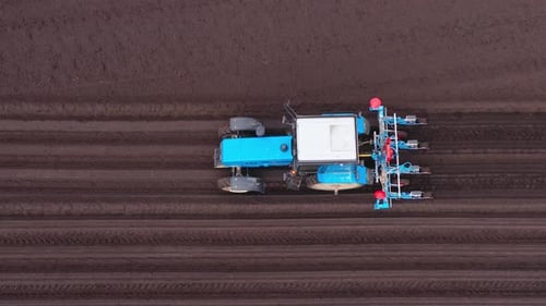 Tractor with Seeder in the Field