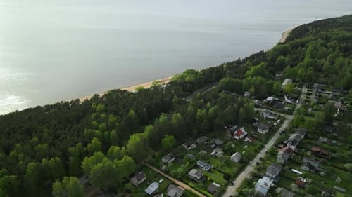 A Breathtaking Aerial View of a Serene Coastal Landscape Showcasing Lush Greenery and Tranquil