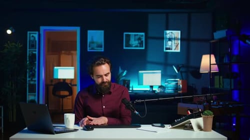 Man Filming Video for Online Channel Presenting Mouse and Keyboard