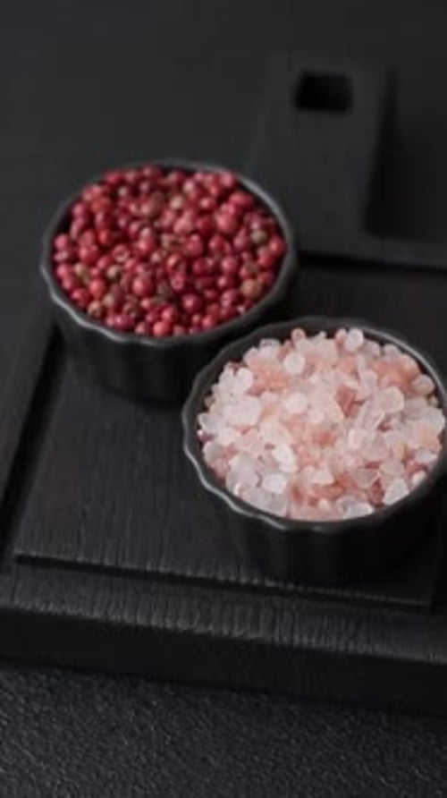 Pink Himalayan Salt and Red Peppercorns in Bowls
