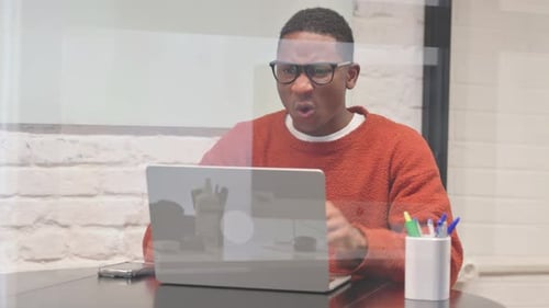 Young Adult Upset About Computer Problem at Work