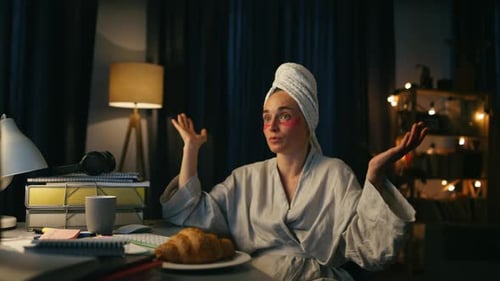 Woman on Computer Wearing Towel and Eye Masks