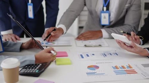 Close up of business hands are working and brainstorming on paperworks.