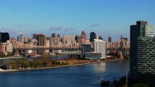 East River Panorama in Autumn with Roosevelt Island Queensboro Bridge with Skyscrapers of Long
