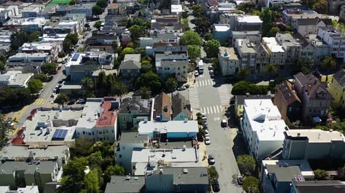 Aerial view tracking traffic in the neighborhoods of San Francisco, sunny USA