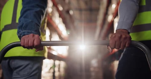 People, hands and warehouse with trolley in logistics for moving shipment, cargo or stock