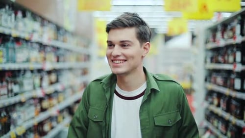 Close Up Smiling Man Walk with Shopping Cart at the Supermarket Feel Happy Hypermarket Hand Food