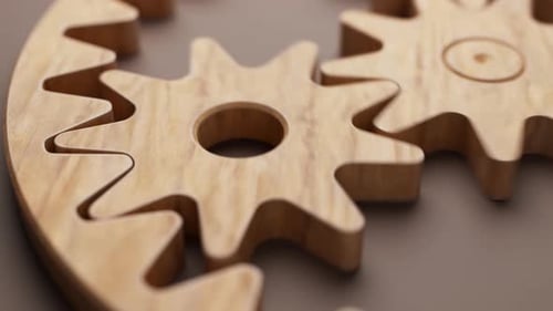 Animación en bucle de un mecanismo de madera formado por engranajes